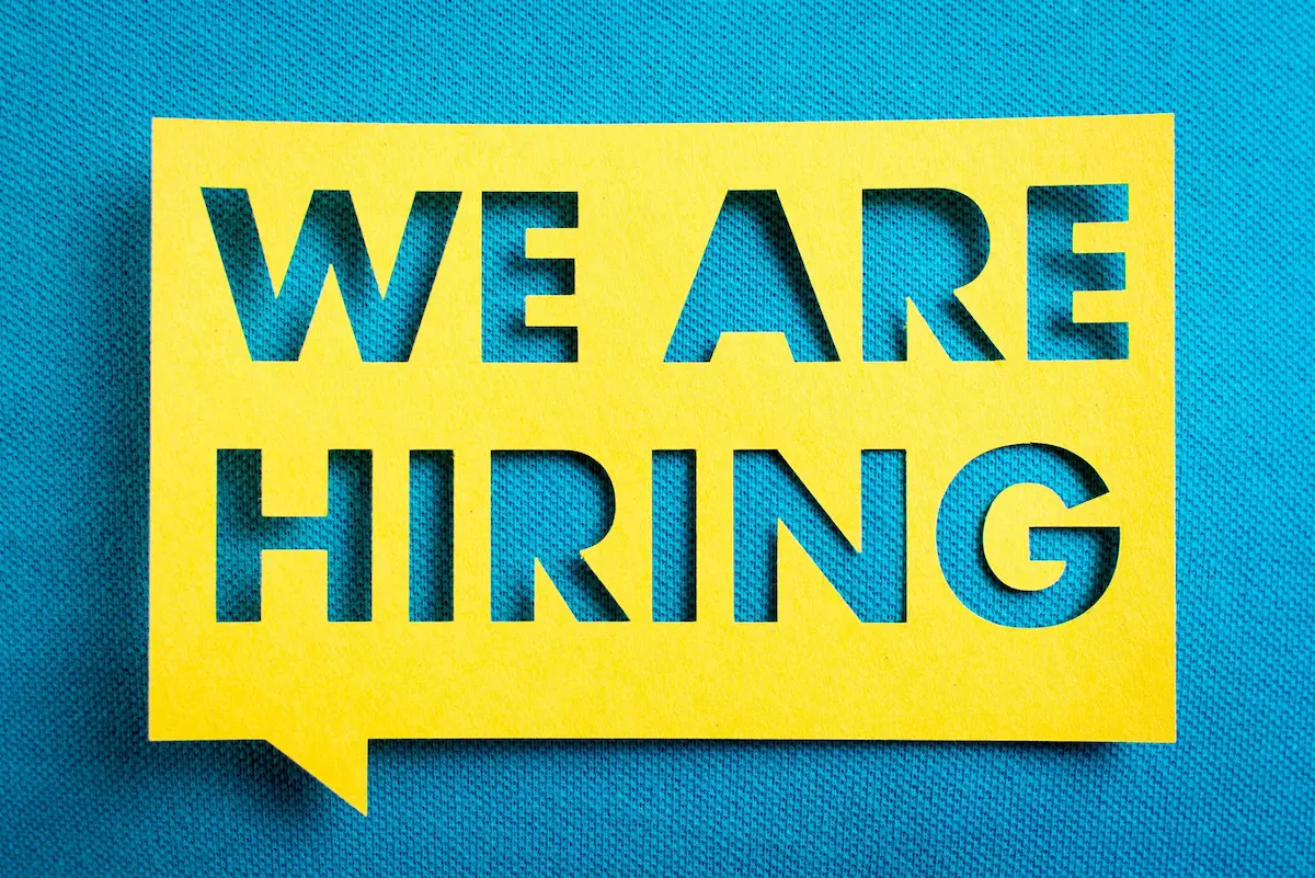 'We are hiring' poster.