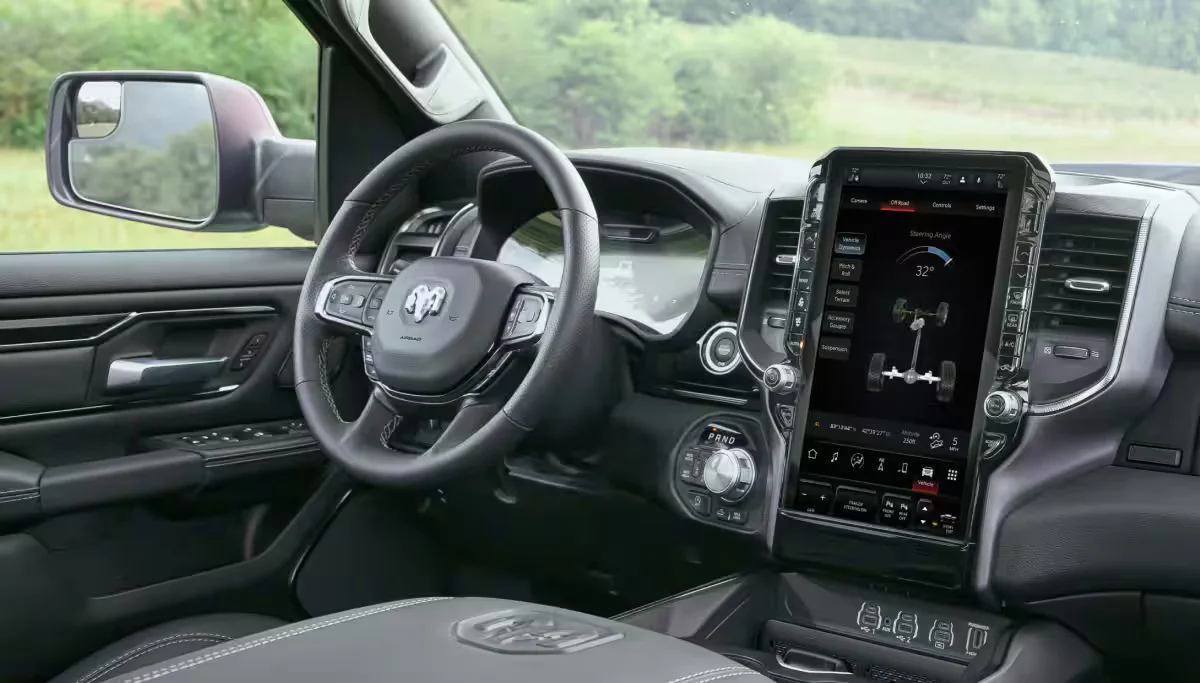 2026 RAM 1500 driver cockpit with steering wheel and large vertical touchscreen